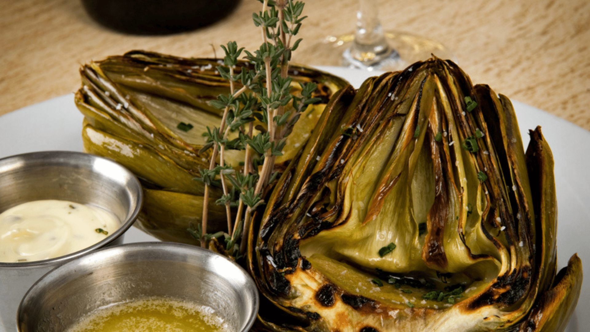 grilled artichokes recipe with Chile Crunch spicy condiment